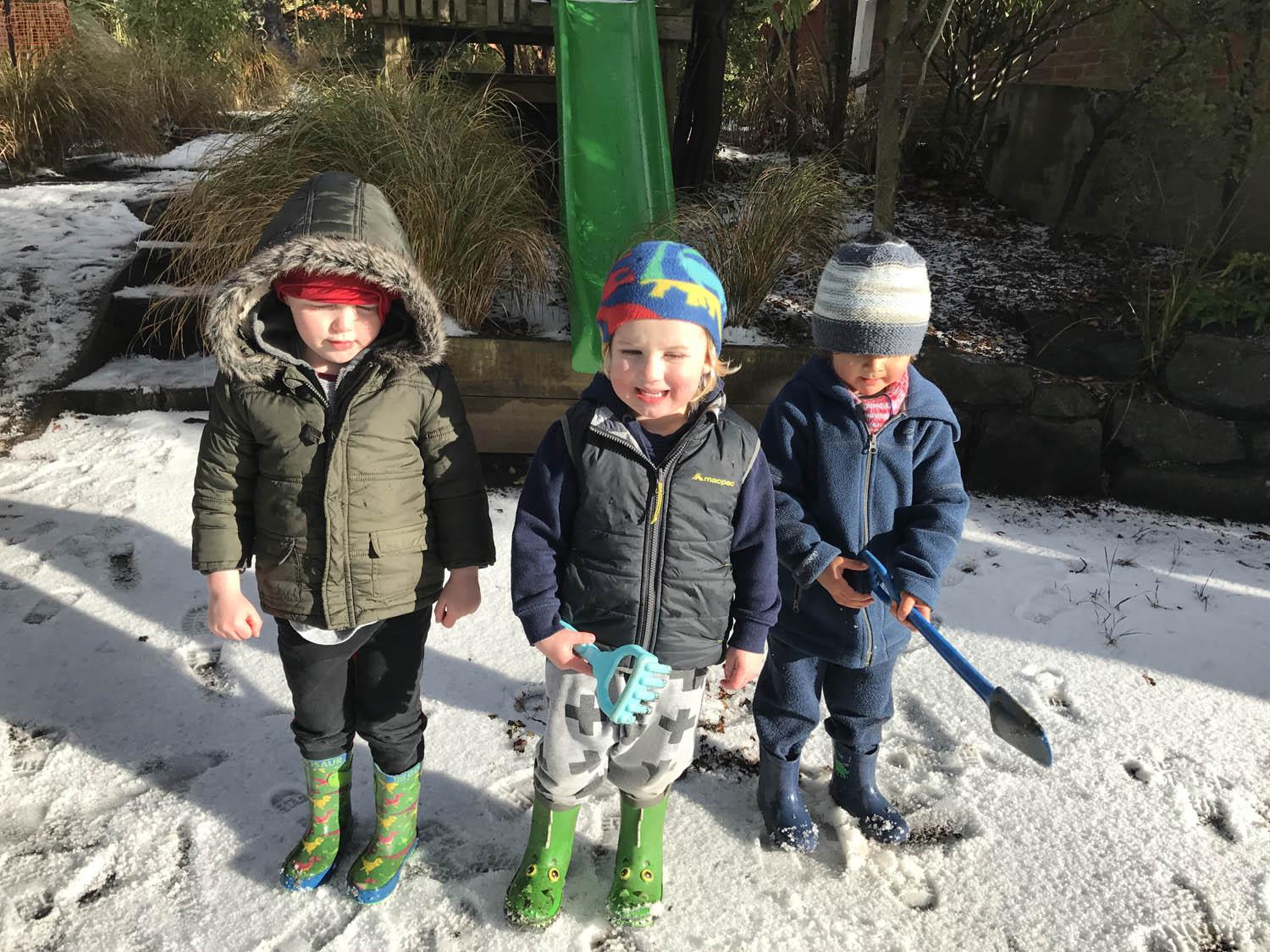 Three children in winter clothing
