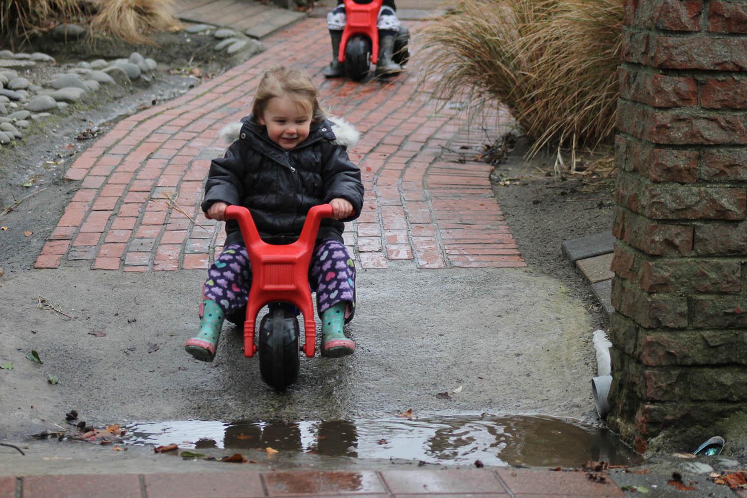 Kid riding toy bike