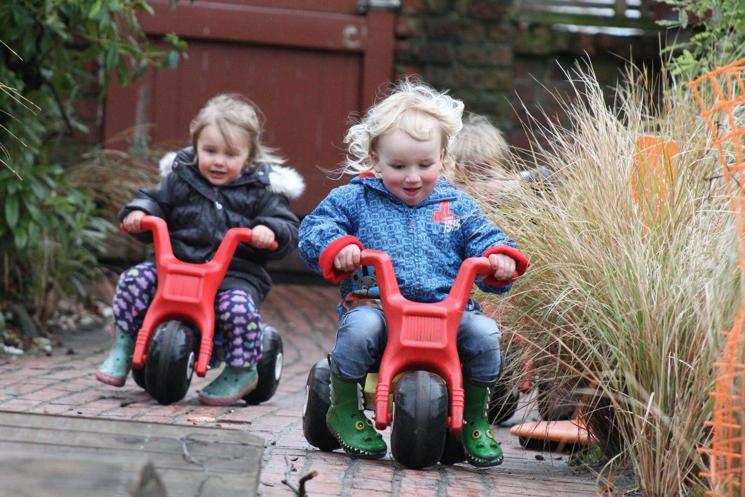 Kids riding toy bikes