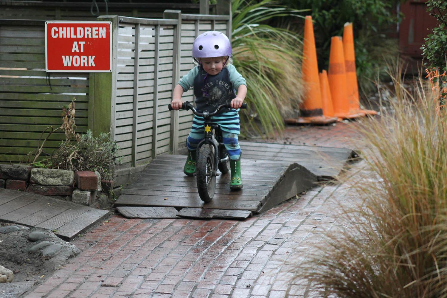 Kid on training bike